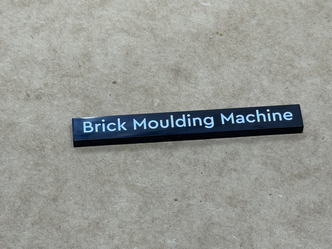 LEGO Parts - Black Tile 1 x 8 'Brick Moulding Machine' - No 4162pb275 - QTY 1
