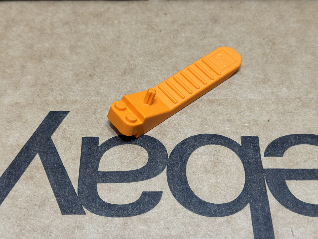 LEGO Parts - Orange Brick and Axle Separator - No 96874 - QTY 1
