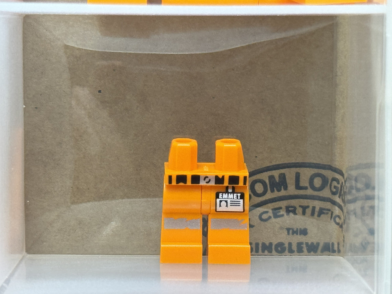 LEGO Parts - Orange Hips Legs Belt, 'EMMET' Name Tag - No 970c00pb0897 - QTY 1