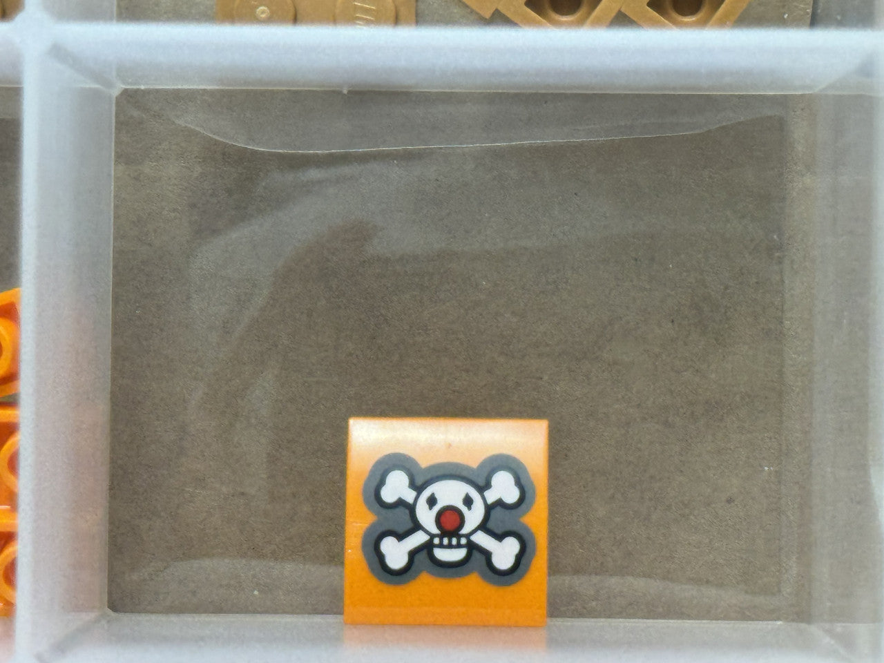 LEGO Parts - Orange, Curved 2 x 2 White Skull Crossbones - No 15068pb642 - QTY 1